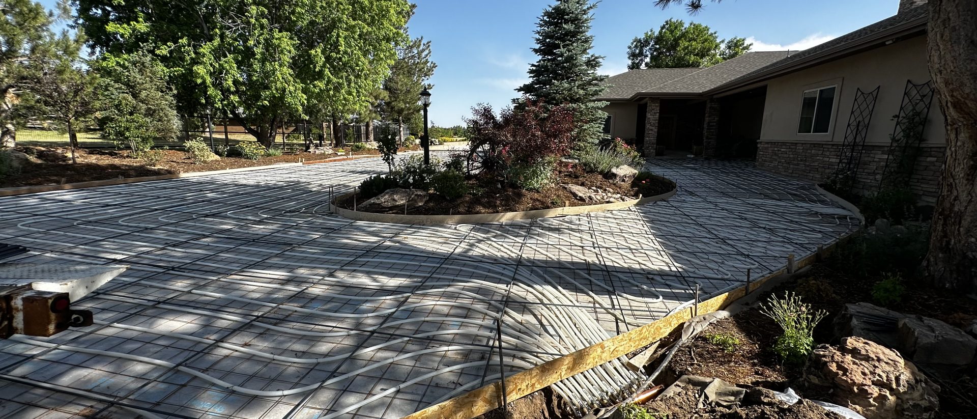 Decorative concrete driveway with landscaping